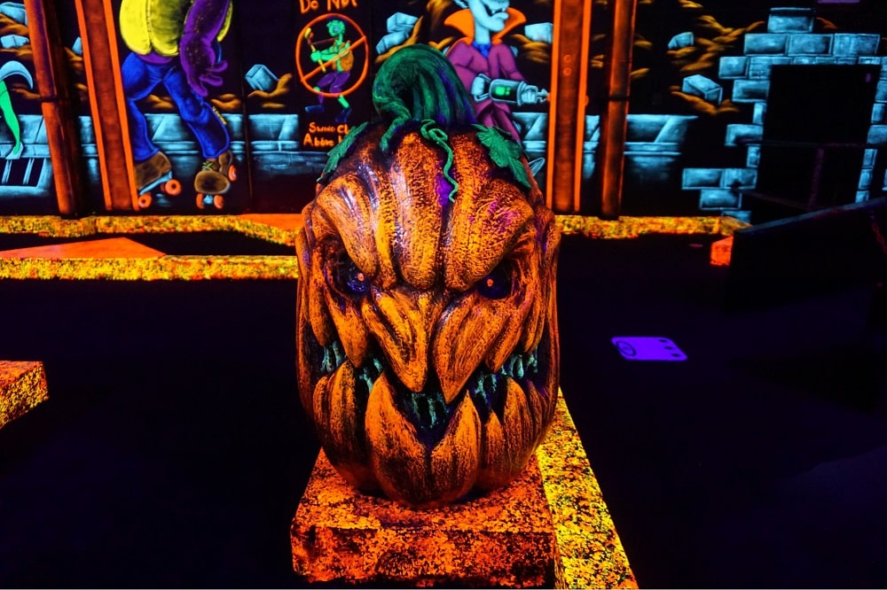 Monster Mini Golf 14 A neon orange monster at monster mini golf.